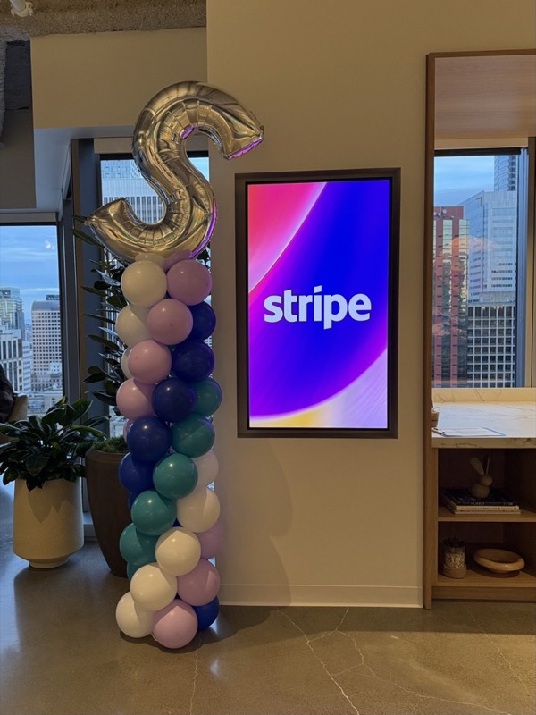 A colorful branded balloon installation for a corporate event